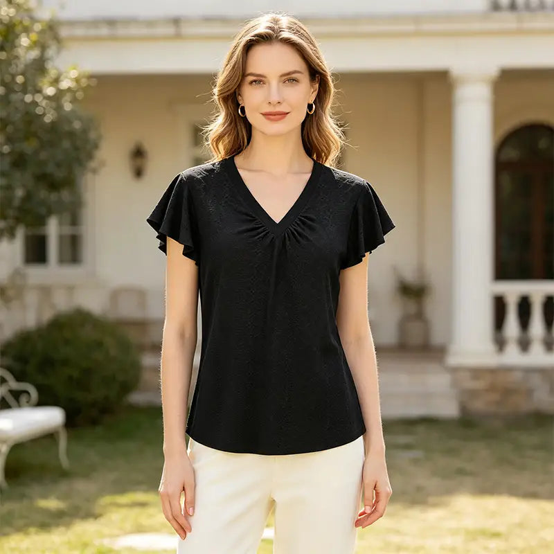 👚 Modny bawełniany T-shirt z dekoltem w serek, bufiastymi rękawami i eleganckimi wycięciami